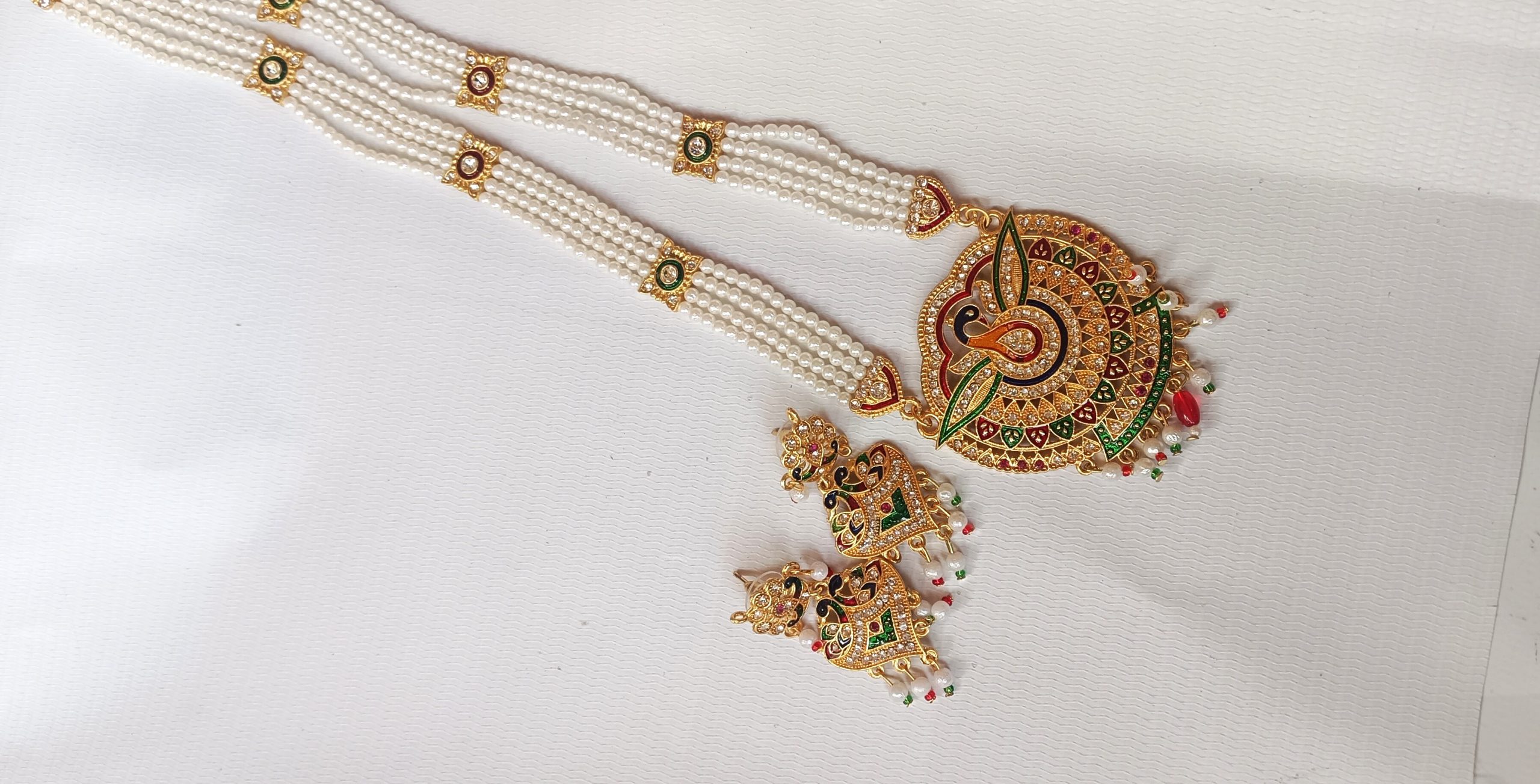 Rajasthani pearl beaded imitation necklace set with a peacock design pendant and matching Earrings. - Image 3