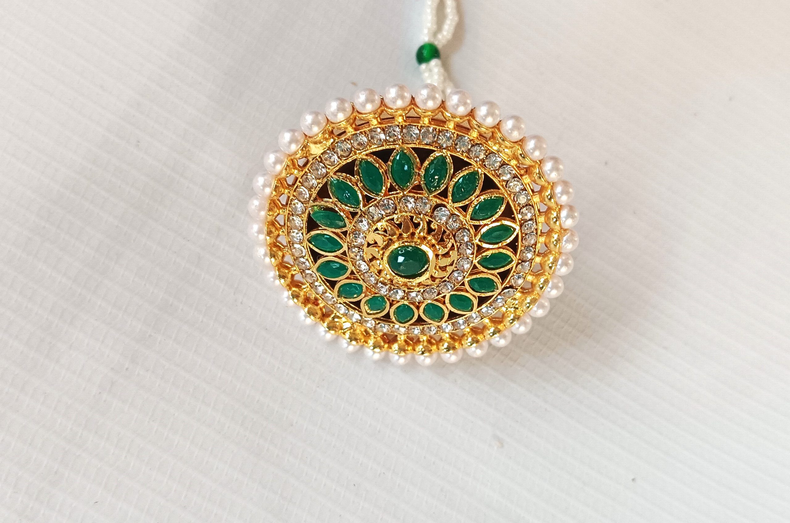 Rajasthani Gold-Plated imitation Maang Tikka with Green & White Stones.