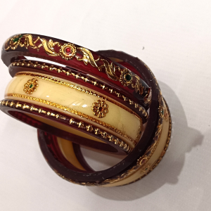 Maroon Acrylic Designer Bangles Set with Golden Floral Design & Stones