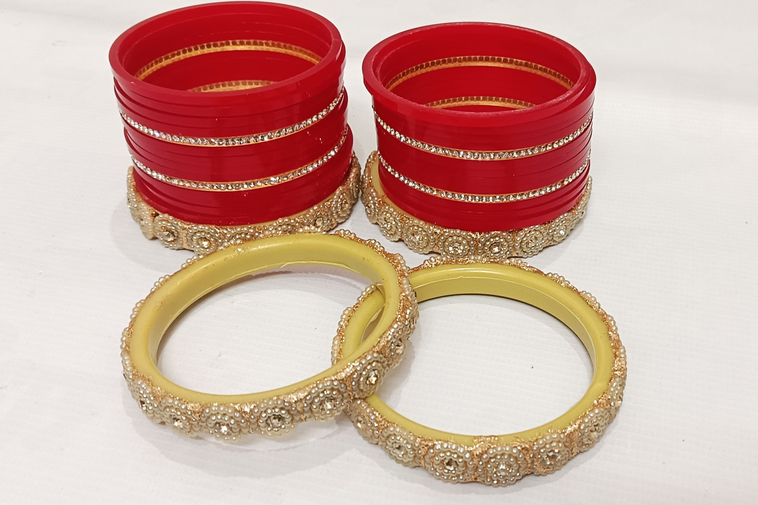Red bridal chura set with pearl-studded golden kada and rhinestone detailing. - Image 3